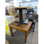 An oak draw leaf table and a circular pedestal dining table,