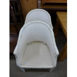 A pair of Chinese style cream faux bamboo tub chairs