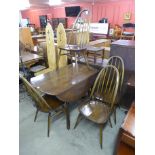 An Ercol drop-leaf table and four chairs