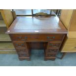 A yew wood kneehole desk