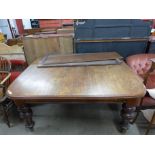 A Victorian mahogany extending dining table