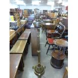 A Victorian Aesthetic Movement brass standard lamp