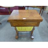 A George IV rosewood games and sewing table