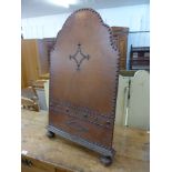 A French oak and leather firescreen