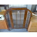 An Art Deco walnut display cabinet