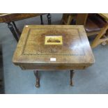 A Victorian burr walnut games and sewing table,