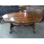 A George IV rosewood serpentine centre table