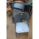 A set of four American Kruger metal folding chairs