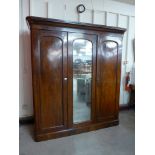 A Victorian mahogany fitted three door wardrobe