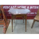 An Arts and Crafts oak octagonal occasional table