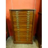 A Victorian walnut graduated collectors chest