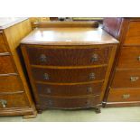 An oak bow front chest of drawers