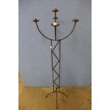 A cast metal candle stand