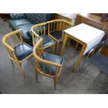 A small drop-leaf kitchen table and four corner chairs