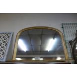 A gilt framed overmantel mirror