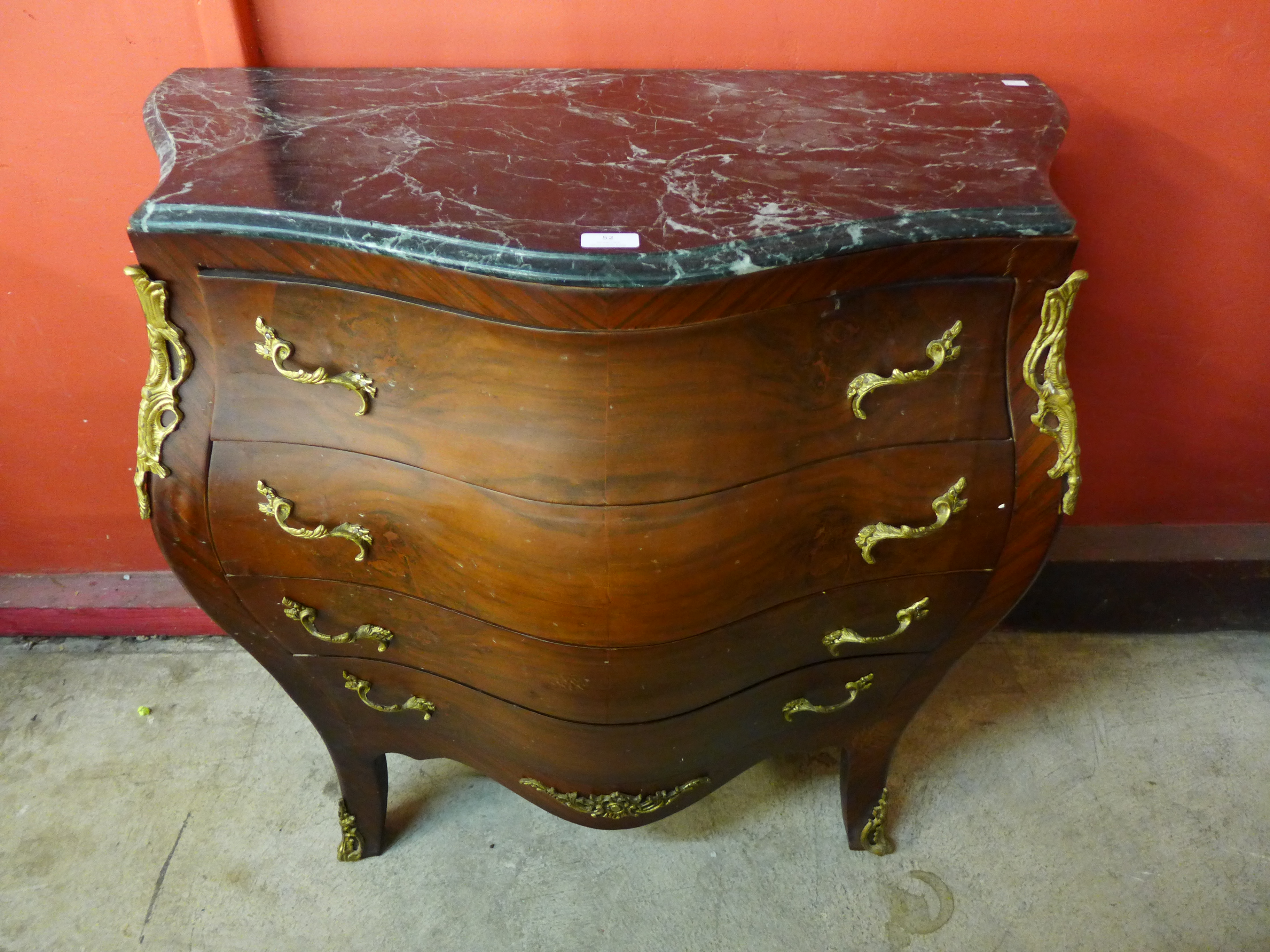 A French Louis XV style marble topped serpentine commode