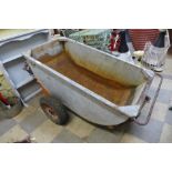 A galvanised trough on wheels