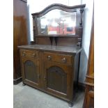 An oak mirrorback sideboard