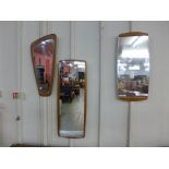 Three teak framed mirrors