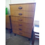 A teak chest of drawers