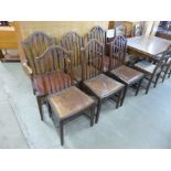 A set of six George III oak dining chairs