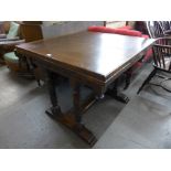 An oak draw-leaf table