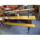 A German folding trestle table and two benches