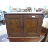 An Edward VII oak table top cabinet