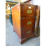 A campaign style mahogany and green leather pedestal chest