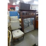 A Victorian oak armchair and matching side chair and an overmantel mirror