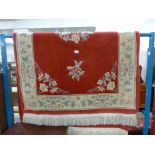 A Chinese red ground rug