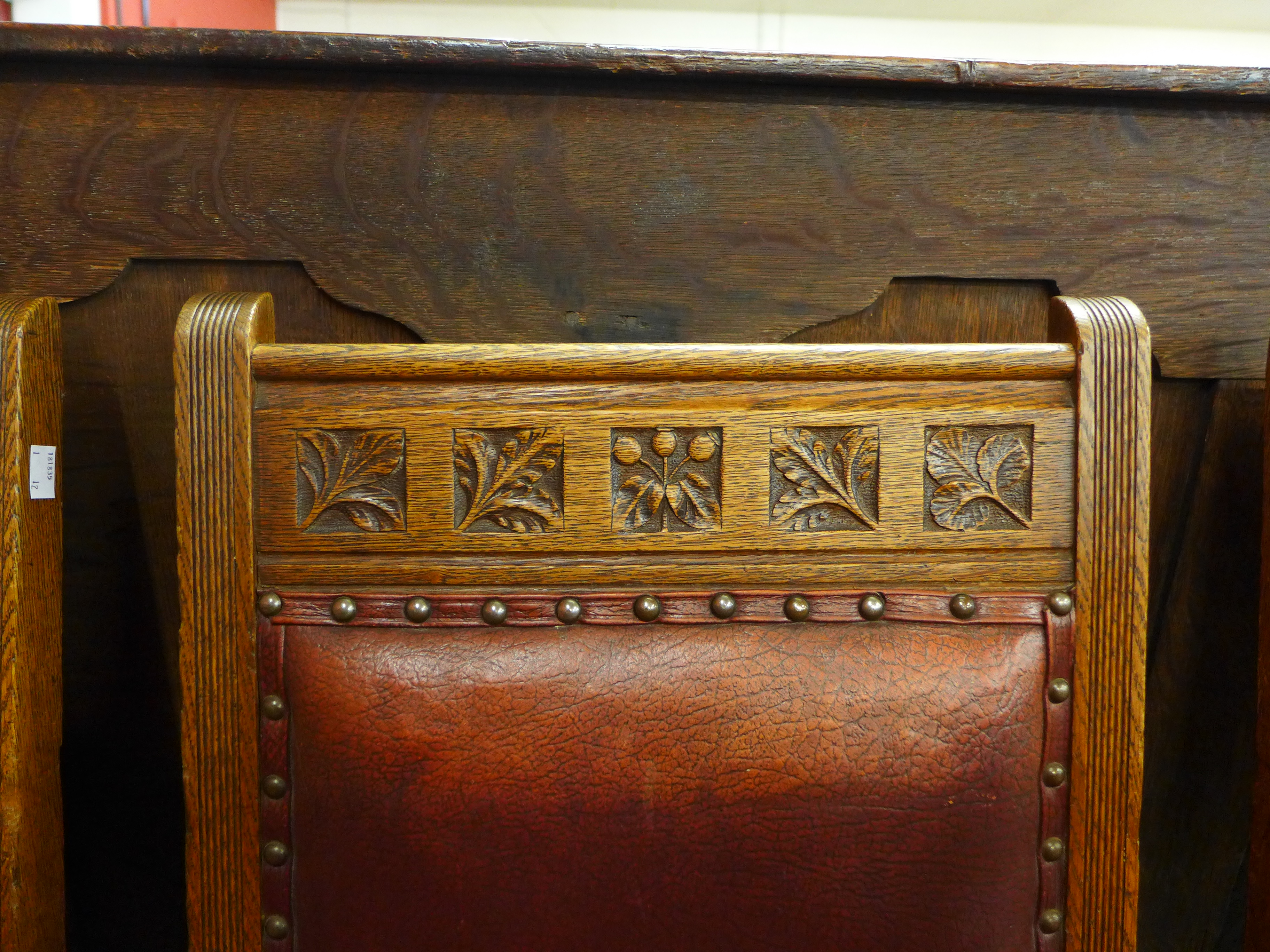 A set of ten Victorian oak and leather dining chairs, made by Plunknett & Steevens, - Image 6 of 7