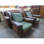 A 1920's carved oak and brown leather upholstered three piece suite