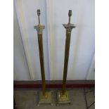 A pair of similar brass Corinthian column standard lamps