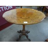 A Victorian inlaid walnut tripod table