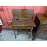 A Victorian mahogany fold-over writing table