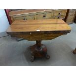 A Victorian rosewood fold-over card table