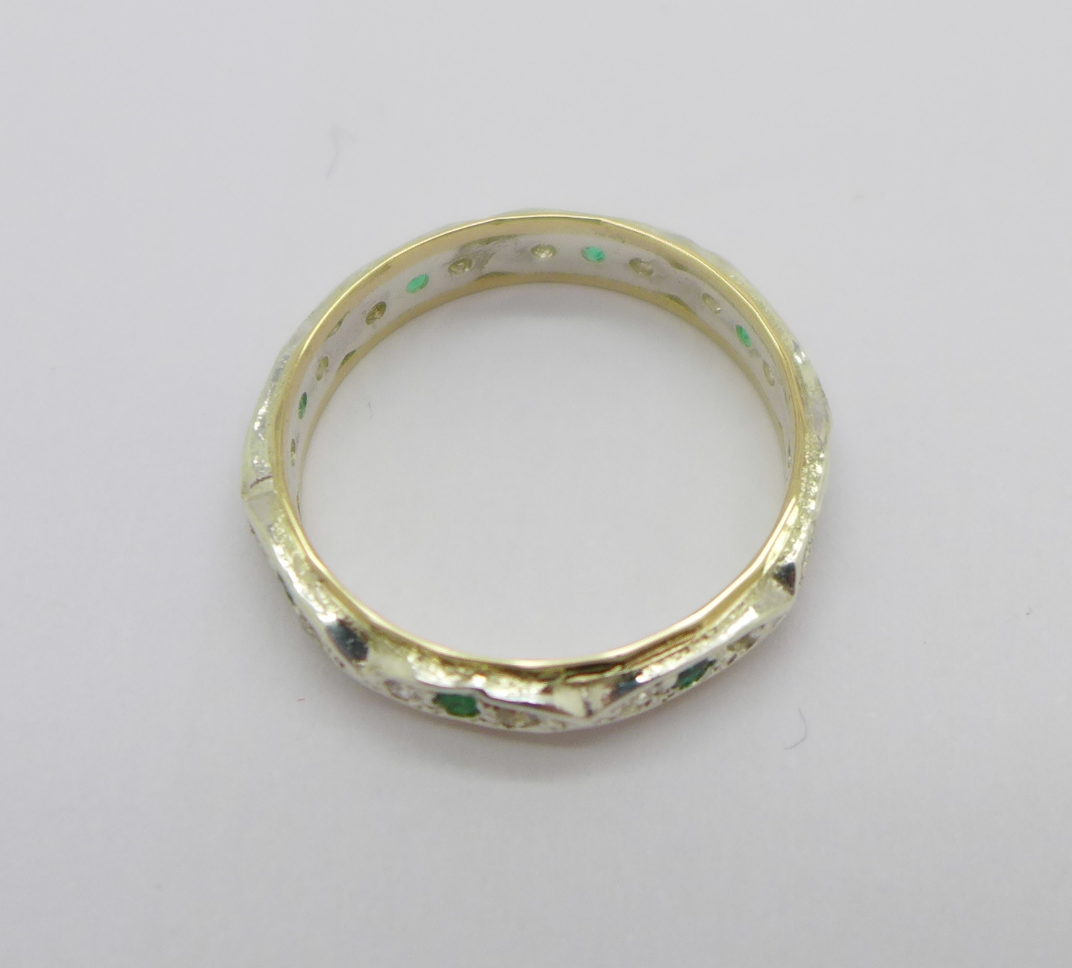 A 9ct gold and silver set emerald and diamond full eternity ring, - Image 2 of 2