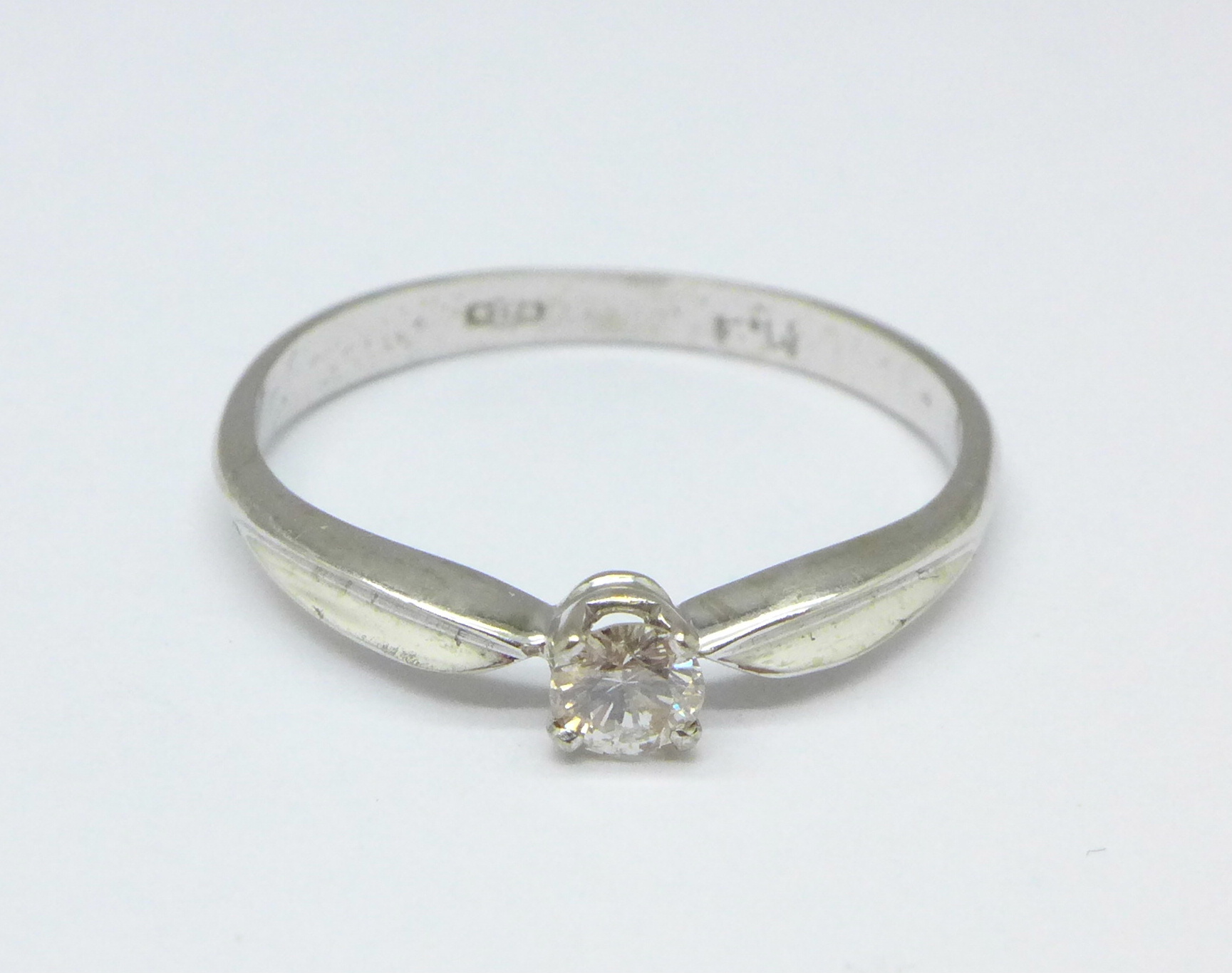 An 18ct white gold and diamond solitaire ring, 2.