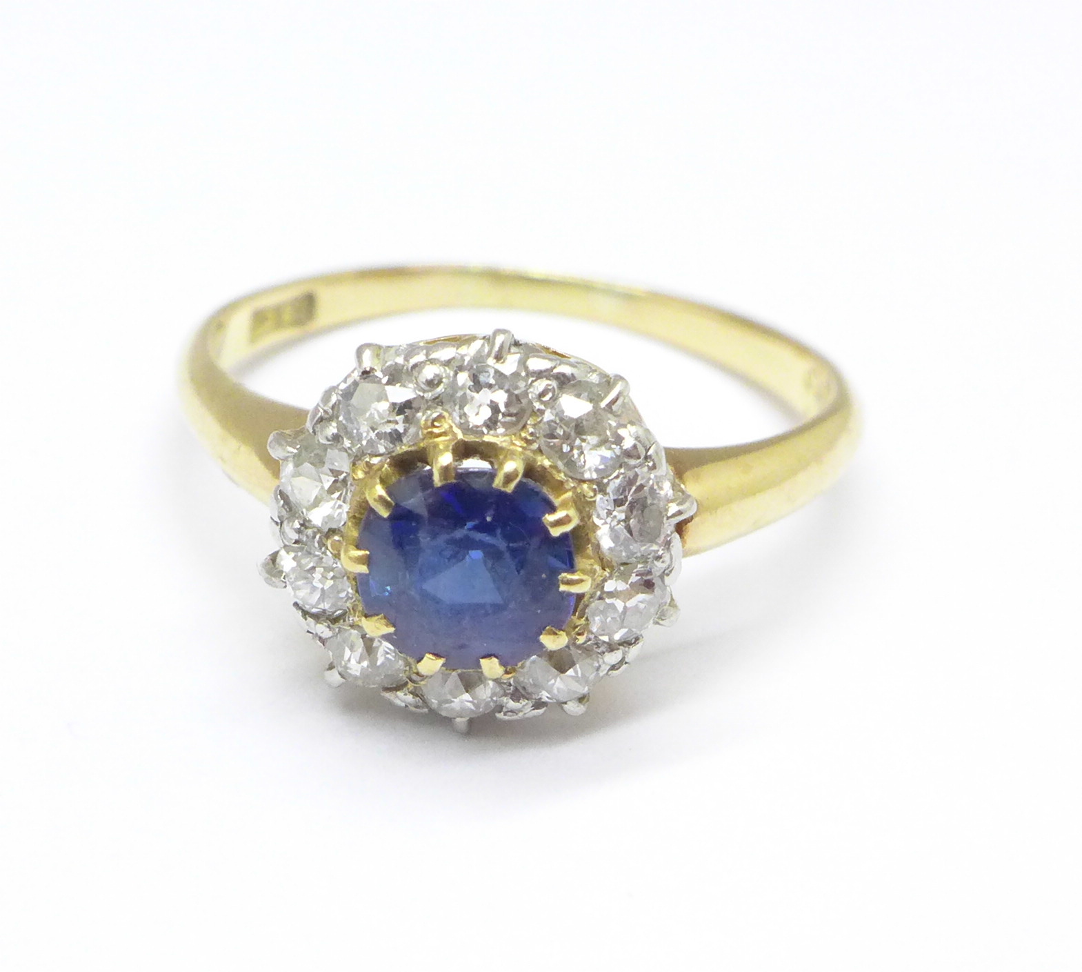 An 18ct gold, sapphire and diamond cluster ring, 4.