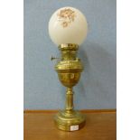 A Victorian brass oil lamp (converted for electricity)