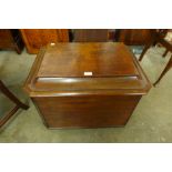 A George III mahogany sarcophagus shaped cellerette