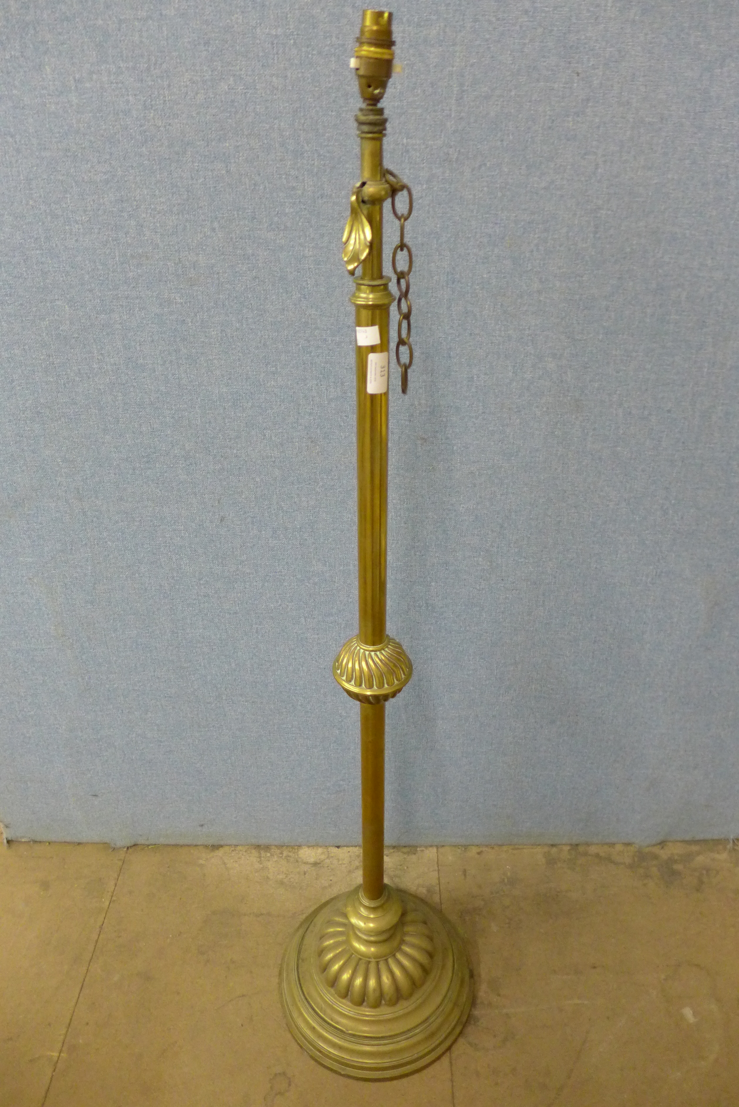 A Victorian Aesthetic Movement adjustable brass standard lamp