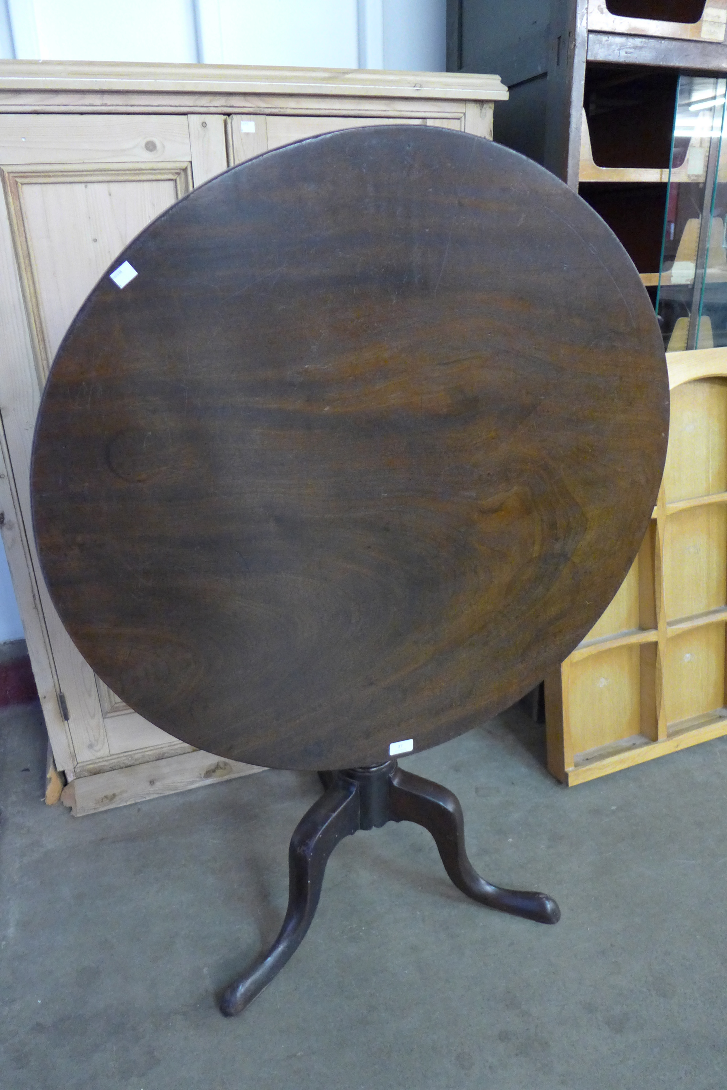 A George III mahogany circular tilt top tripod table