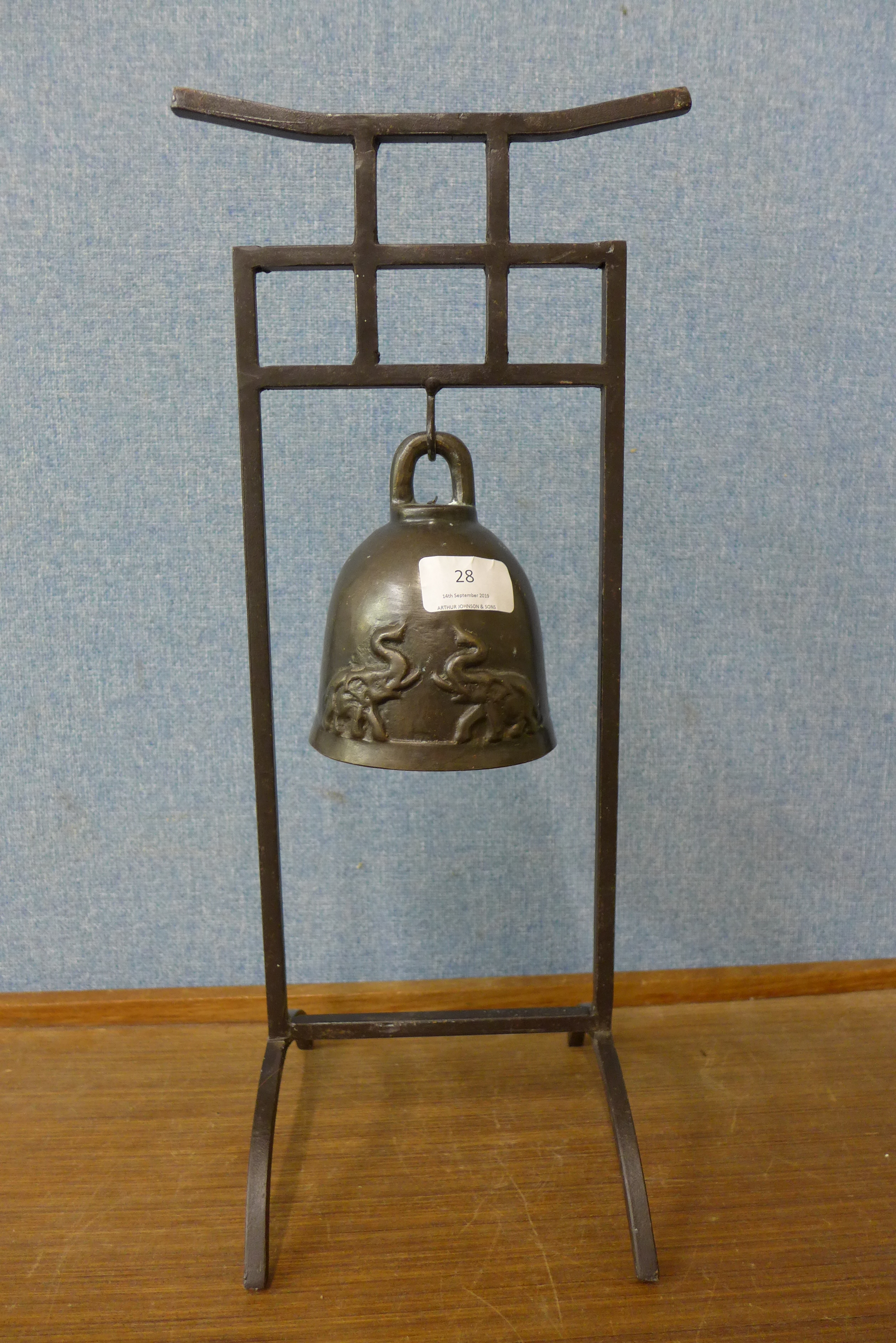 A bronze bell on stand