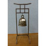 A bronze bell on stand