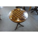 A Victorian mahogany inlaid tripod games table,