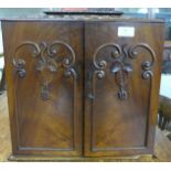 A Victorian carved walnut table top collector's cabinet
