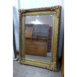 A large 19th Century gilt wood and gesso framed mirror