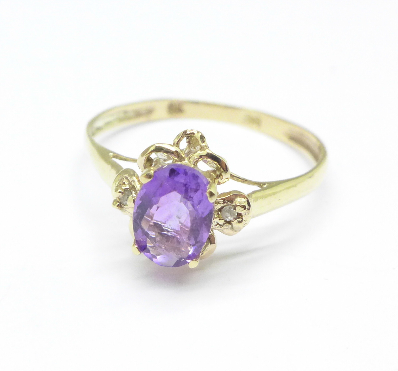 A 9ct gold, amethyst and diamond ring, 1.